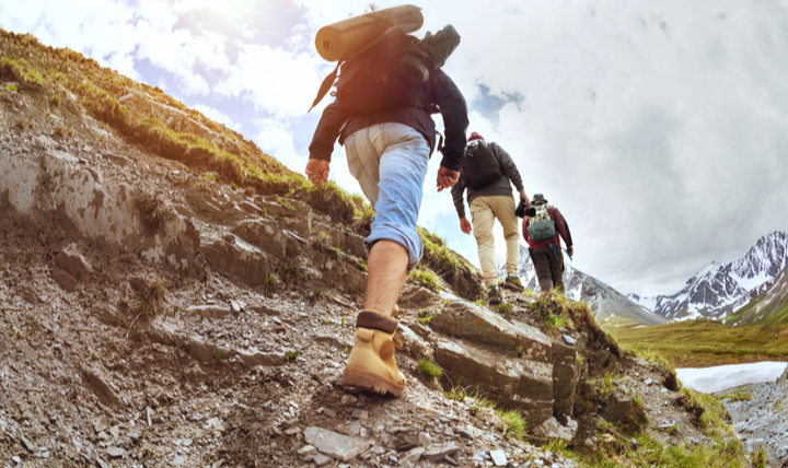 Hikers walking up a hill.