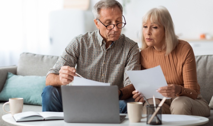 A couple reviewing paperwork together.