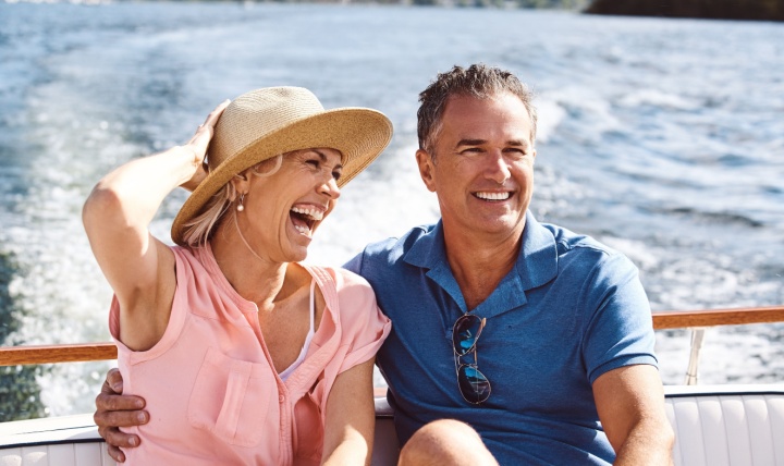 A couple on a yacht cruise.