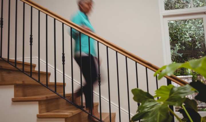 A woman walking downstairs.