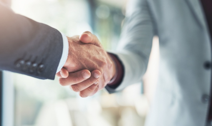 Two people shaking hands.