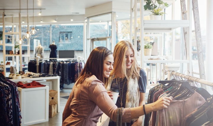 Two women clothes shopping.