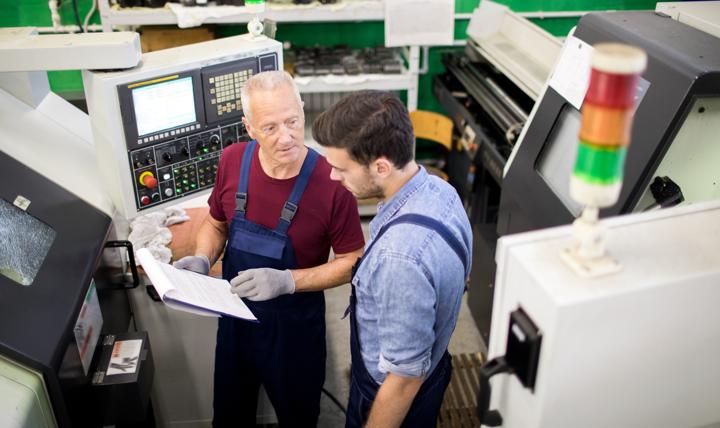 Two workers discussing a project.