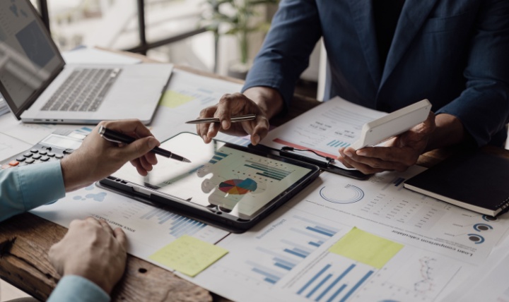 Business people looking at documents in an office.