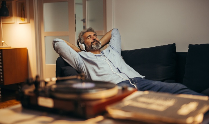A man relaxing while listening to music.