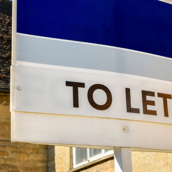 A “to let” sign outside of a home.