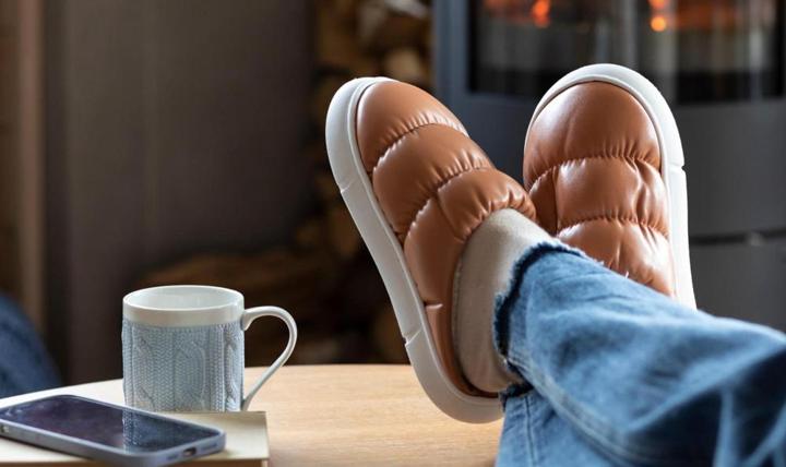 A person sitting with their feet up.