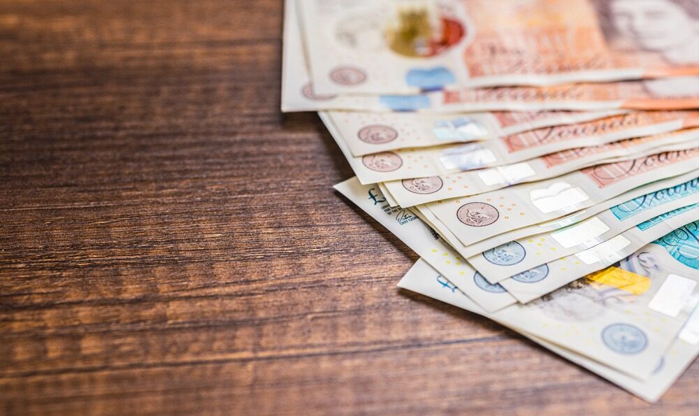 UK bank notes on a table.