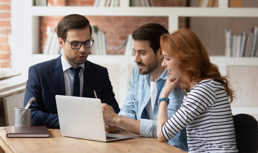 A couple speaking to a mortgage adviser.